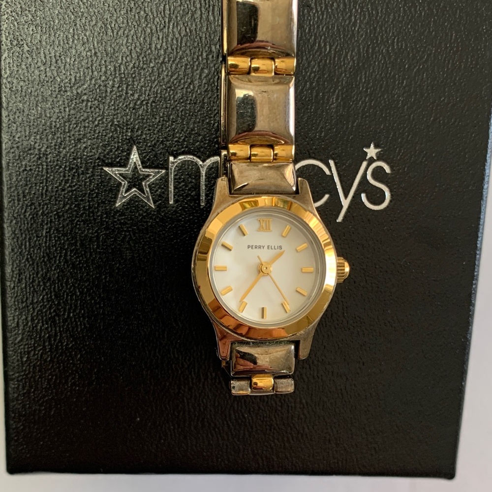 Elegant & Stylish Perry Ellis Women's Watch with Gold and Silver Accents.